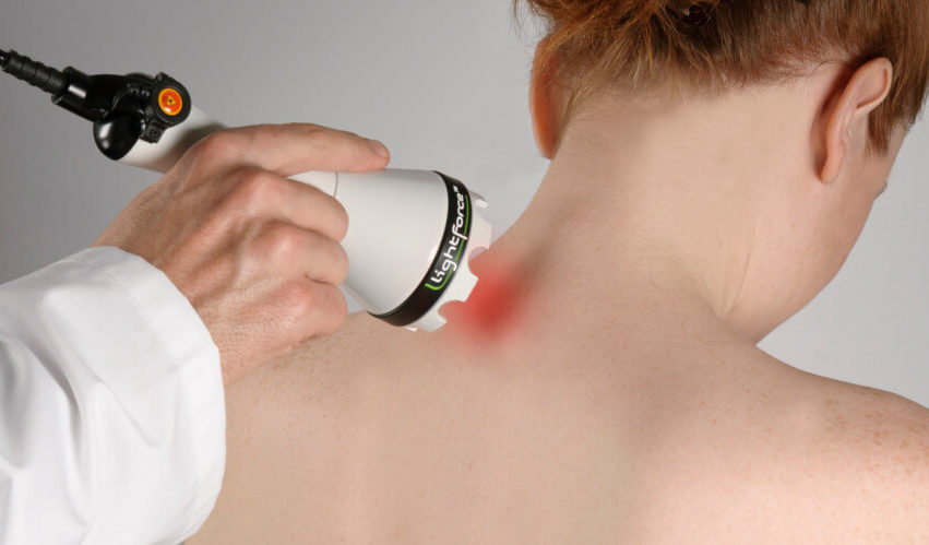 Laser therapy helping a patient with neck and back pain.
